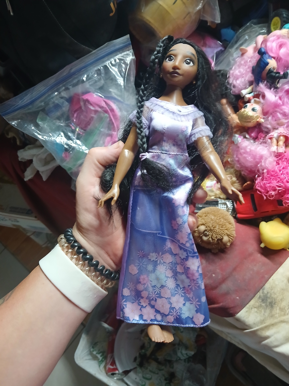 the purple floral dress from a Disney Encanto Isabela fashion doll